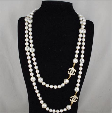 chanel black pearl earrings|Chanel pearl necklace and earrings.